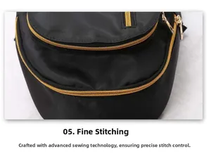 Close-up of fine stitching and golden zippers on a black waterproof fabric backpack