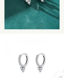 Close-up of S925 sterling silver hoop earrings with shimmering white zircon stones