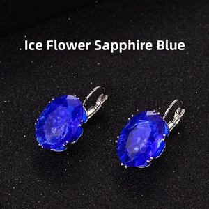 Detail of ice flower royal blue oval gemstone earrings with silver leverback closure