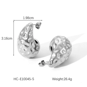 Detailed view of silver irregular teardrop earrings with hammered texture and dimensions