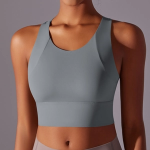 Close-up of seamless grey sports bra featuring a wide bottom band and supportive fabric