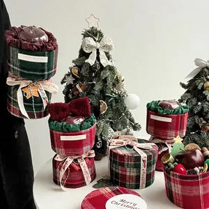 Christmas British plaid gift boxes with ribbons and festive decorations in a cozy scene