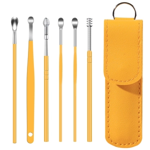 6-piece stainless steel earwax removal kit with a yellow leather portable storage case