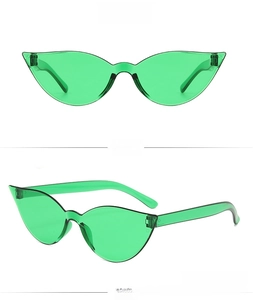 Close-up of green cat eye sunglasses with irregular frame and seamless rimless design