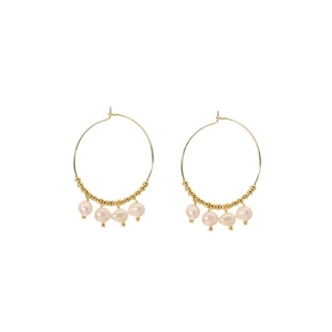 Golden hoop earrings with delicate beads and white freshwater pearls on white background