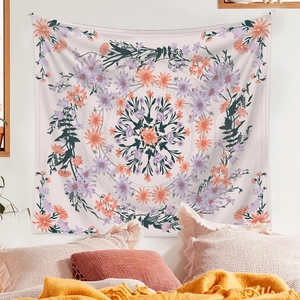 Detail shot of the mandala tapestry hanging in a bedroom with orange floral patterns