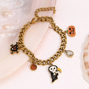 Halloween charm bracelet with 18K gold plated pumpkin and skull pendants on Cuban chain