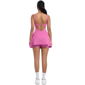 Pink tennis dress featuring U-shaped open back and built-in safety shorts with slim fit