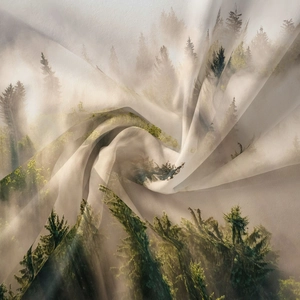 Detailed close-up showing silky fabric texture and misty forest prints on tapestry