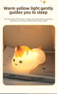 Macro view of a soft silicone unicorn night light glowing with warm yellow light on a book