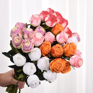 Handheld bouquet of colorful realistic faux roses in pink white and purple for decor