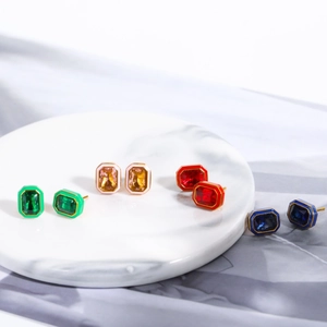 Detail showing rectangular zircon earrings with enamel frames in various pastel colors