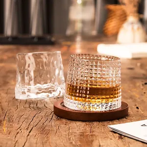 Rotating crystal whiskey glasses with wood base featuring diamond and ripple textures