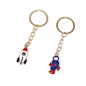 Cartoon astronaut and space rocket keychain set with gold metal rings and colorful charms