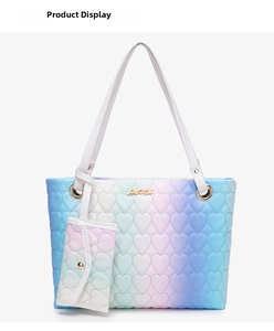 Detail of heart quilted macaron gradient tote bag with golden hardware and mini pouch