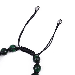 Detail of 8mm green tiger eye stone bracelet featuring adjustable flat knot closure