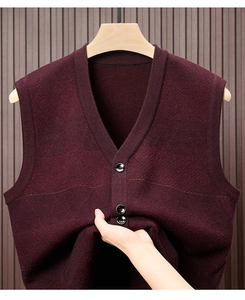 Detailed close-up of wine red V-neck knitted vest sweater with button design and rhombic patterns