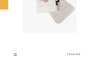 Detailed cable knit texture of assorted winter beanies in beige and soft pink tones