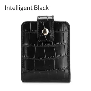 Detailed view of crocodile pattern leather lipstick pouch with mirror in smart black