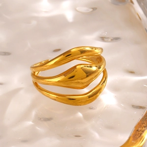 Minimalist gold multi-layer wavy ring with mirror-polished finish on water ripple tray