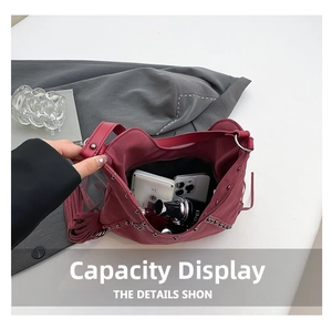 Detail view of burgundy hobo bag interior showing large capacity for essentials