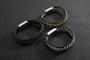 Close-up of woven leather bracelets with gold, silver and black stainless steel clasps