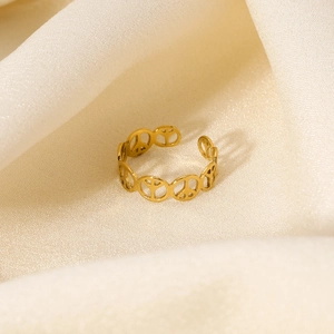 Polished gold stainless steel open ring with hollow peace sign design for women