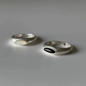 Minimalist matte silver open rings set with white shell and black onyx stones