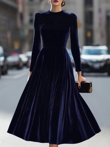Detailed texture of dark purple velvet long sleeve dress with elegant A-line silhouette