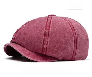 Close-up of red washed cotton retro docker cap with detailed stitching and vintage texture
