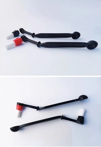 Detail of coffee machine cleaning brush with detachable nylon bristles and scoop handle