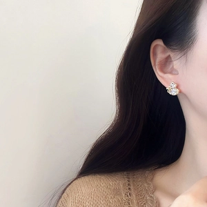 Elegant gold plated gourd stud earrings with zircons shown on model for women