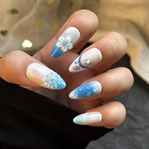 Blue and white gradient press-on nails with 3D floral, pearl and water drop designs