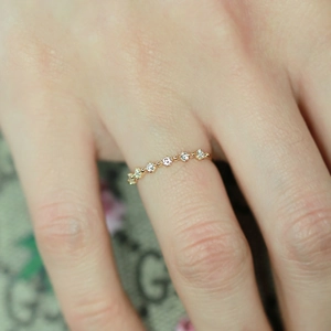 Detail shot of slim gold-plated silver ring featuring micro-set zircon crystals