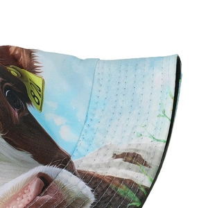 Detailed close-up of cow print sun hat showing quality stitching and digital animal patterns