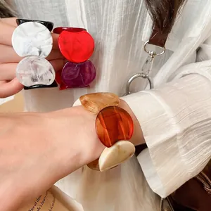 Fashionable minimalist acrylic bangle bracelets with marble patterns in vibrant colors