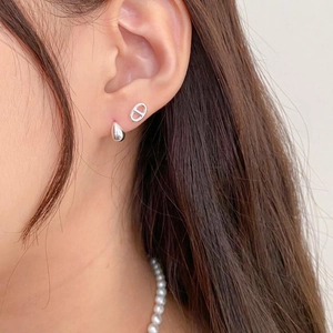 Minimalist 925 sterling silver drop and CD stud earrings shown on model ear