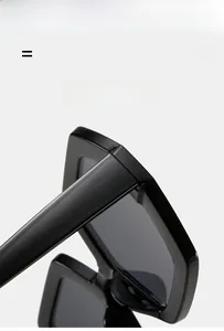 Macro detail of glossy black sunglasses frame featuring lightweight and super elastic material