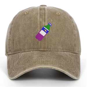 Detailed embroidery of a colorful beverage bottle on a khaki washed cotton baseball cap