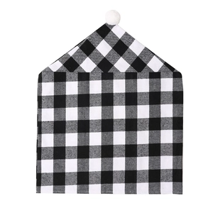 Christmas black and white buffalo plaid chair cover with a white plush pom pom decoration