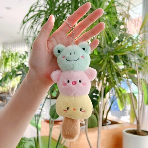 Close-up of plush animal skewer keychain featuring frog, pig and chick characters