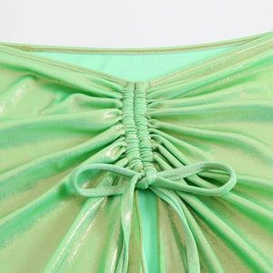 Detail of ruched mint green metallic bikini top with sparkling rhinestone accents