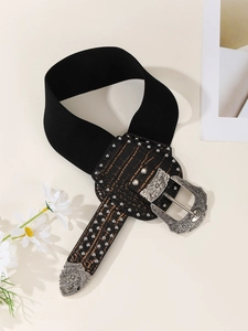 Detail of western-style wide belt with vintage engraved double buckles and leather accents