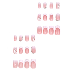 French gradient pink press-on nails with 3D white flowers and sparkling silver rhinestones