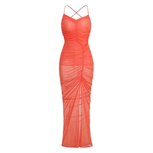 Detail of red ruched mesh dress featuring spaghetti straps and criss-cross back design