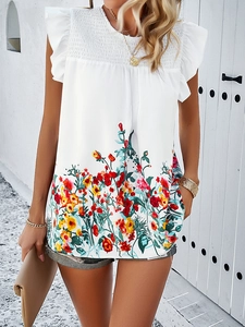 Detail of floral print top featuring ruffle short sleeves and pleated crew neckline