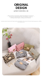 Chic houndstooth and leopard print square bags with gold chains on a modern sofa