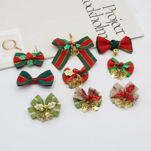 Set of Christmas bows with bells and holly berries for gift wrapping and tree decor