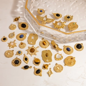 Retro gold stainless steel sun and heart pendants with natural stone inlay on marble