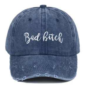 Vintage distressed baseball cap in navy denim with Bad Bitch embroidery and ripped detail